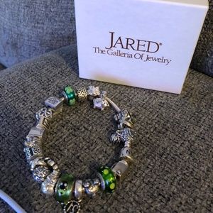 Older pandora charms with 2 bracelets